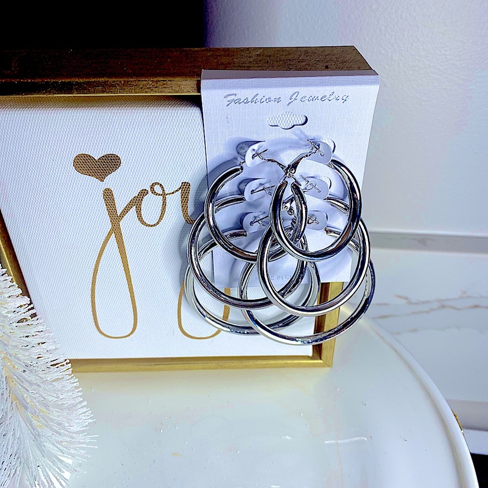 Silver tone hoop earrings.